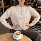 Loose-fitting long-sleeved sweater with flared front