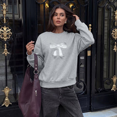 Oversized crew neck sweatshirt with bow and dropped shoulders