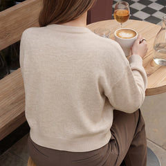 Loose-fitting long-sleeved sweater with flared front