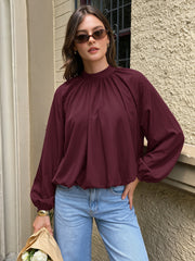 Mock-neck shirt with tie detail and tulip hem