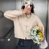 Modern Chinese-style knit jacket with frog closures