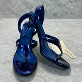 A slip-on toeless open-toe Roman-style shoe