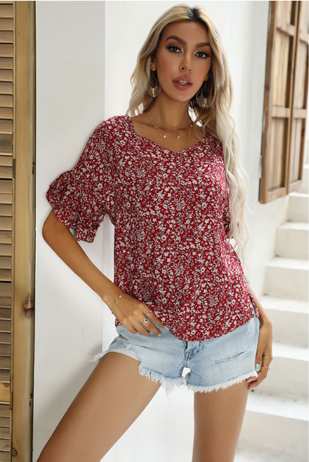 Sidney Bluse mit Blumenmuster und Schimmer-Schößchen 