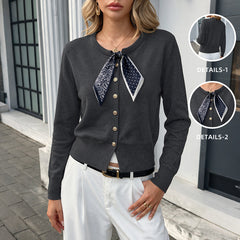 Crew-neck knitted cardigan paired with a silk scarf