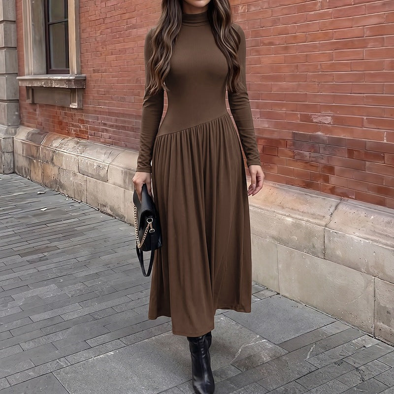 Long-sleeve color-block pleated dress with a fitted waist