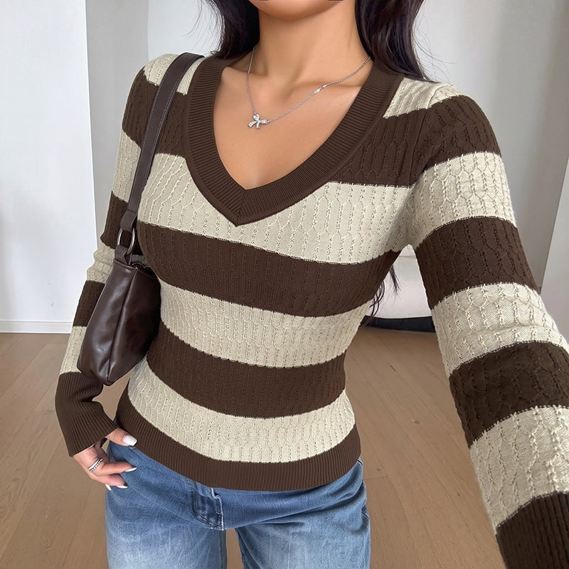 Striped cable-knit sweater with a cut-out waist