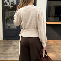 Fitted long-sleeve sweater with a lace-up crossover V-neck