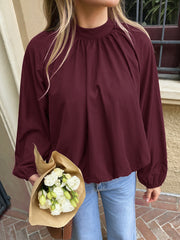 Mock-neck shirt with tie detail and tulip hem
