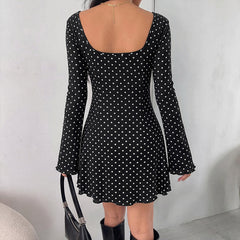Polka-dot lace V-neck dress with flared sleeves and a fitted waist