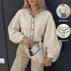 Lantern-sleeve shirt with a stand collar and contrasting piping.