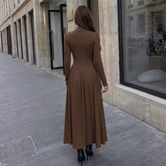 Long-sleeve color-block pleated dress with a fitted waist