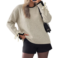 Relaxed-fit sweater with color-block piping and bow-detail cuffs