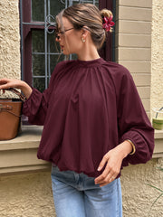 Mock-neck shirt with tie detail and tulip hem